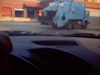 Laborer on outside of truck.